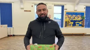 Local Takeaway Owner Spreads Holiday Cheer by Delivering 1,000 Gifts to Needy Children